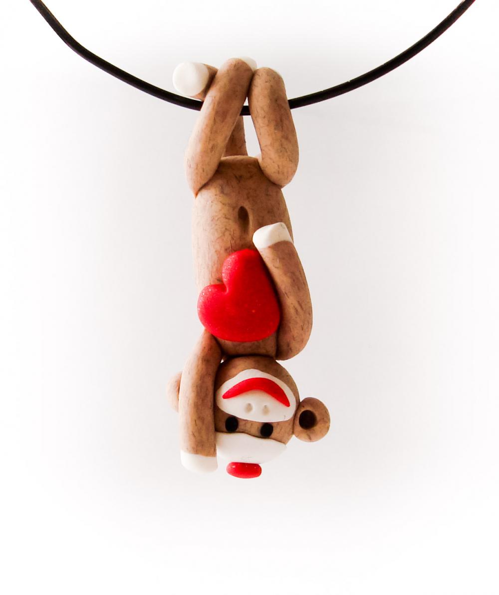 Brown Sock Monkey Pendant Swinging Upside Down holding a Valentine's Day Heart
