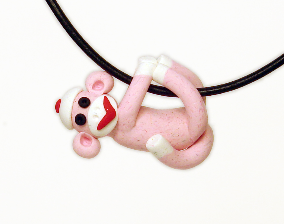 Pink Sock Monkey Pendant Swinging from all fours handmade in Polymer Clay