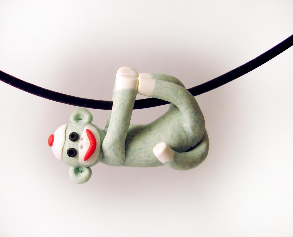 Green Sock Monkey Pendant Swinging from all fours handmade in Polymer Clay
