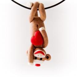 Brown Sock Monkey Pendant Swinging Upside Down holding a Valentine's Day Heart